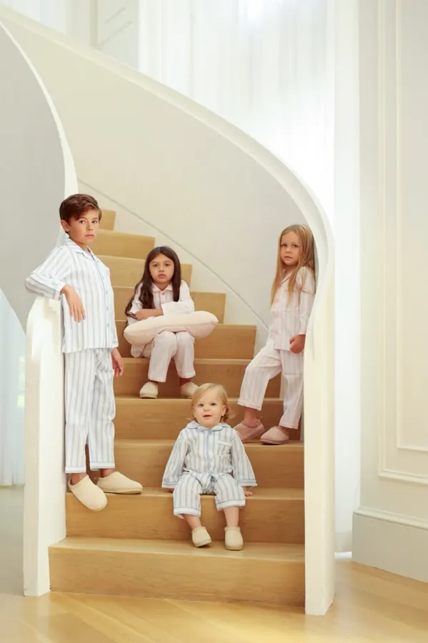 Kids' pajama campaign: siblings on a white staircase, commercial photography by Photoholic, Monsey NY