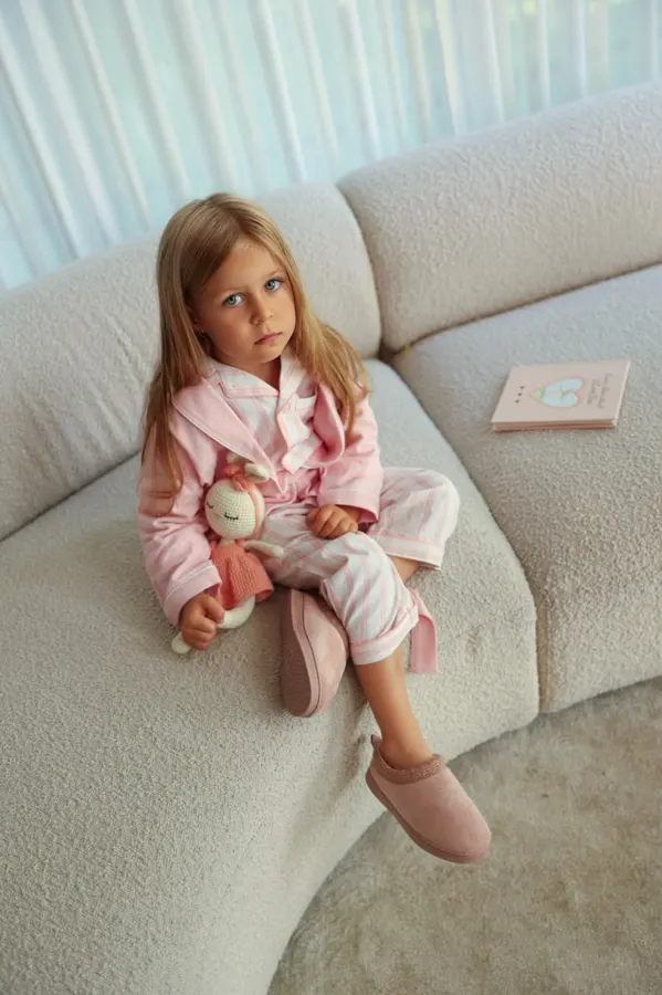Kids' loungewear: girl on a cream sofa, commercial photography by Photoholic, Monsey NY