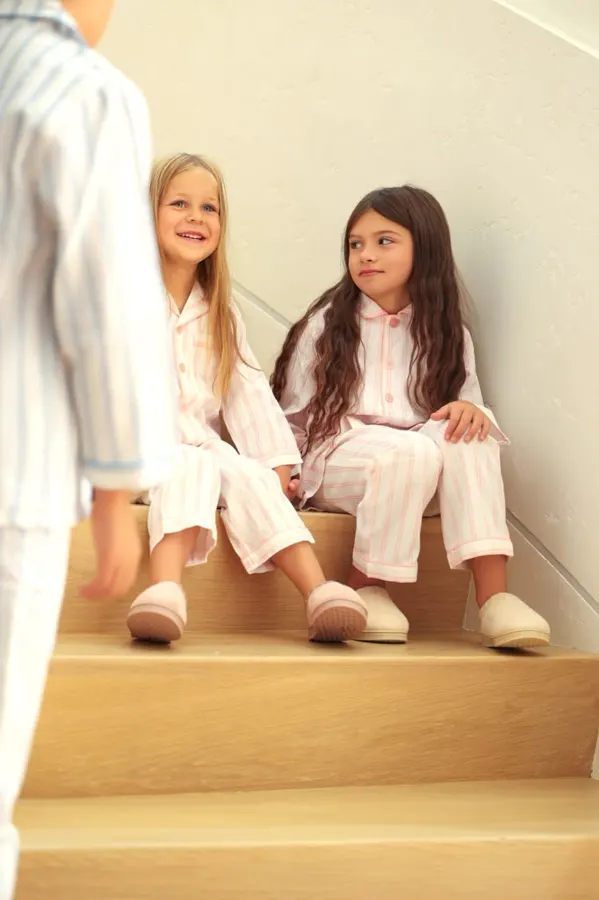 Two girls in loungewear on the stairs, commercial photography by Photoholic, Monsey NY